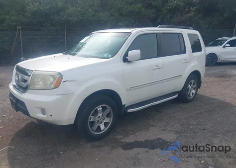 2011 Honda Pilot Touring z USA, uszkodzony, nr VIN 5FNYF4H92BB017270